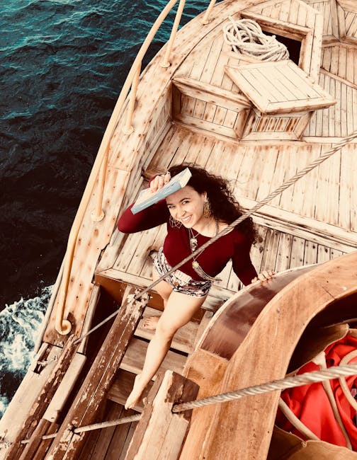 Viaggio nell'arte delle addizioni: l'abaco come antica nave Donna sorridente con libro in mano su antica imbarcazione di legno, metafora del viaggio nel mondo dei numeri con l'abaco.
