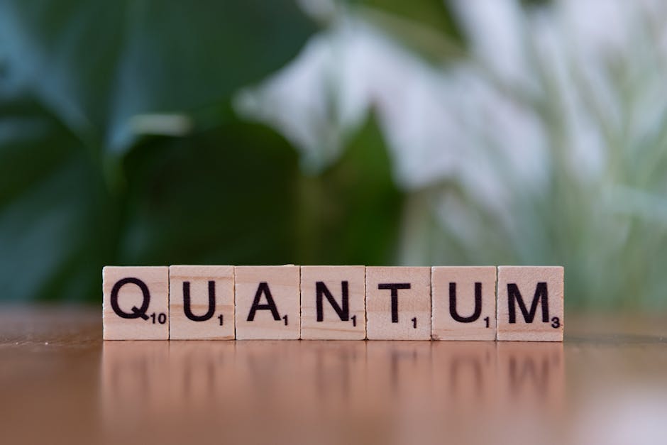 Parola Quantum scritta con tessere di legno, concetto di fisica quantistica e innovazione scientifica nell'articolo.